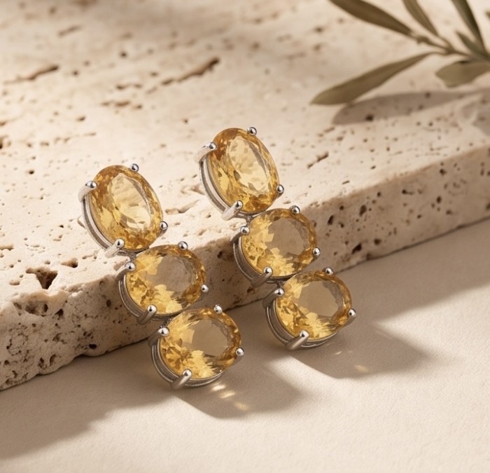 Victoria Authentic 27.2 carat Brazilian Citrine rhodium over .925 Sterling Silver brilliantly handcrafted Statement earrings - Side view of Victoria Authentic Citrine earrings on stone surface