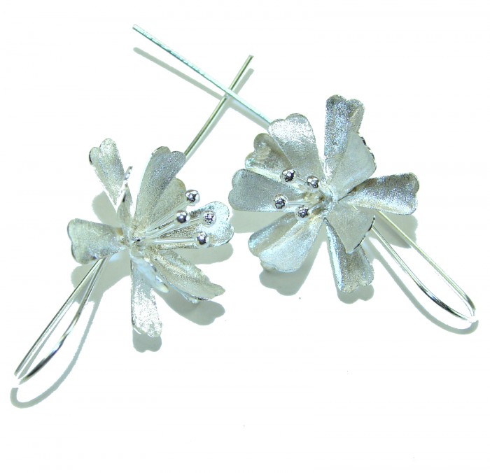 Silver Flowers Italy made .925 Sterling Silver Earrings - Silver flower-shaped sterling silver earrings, top view.