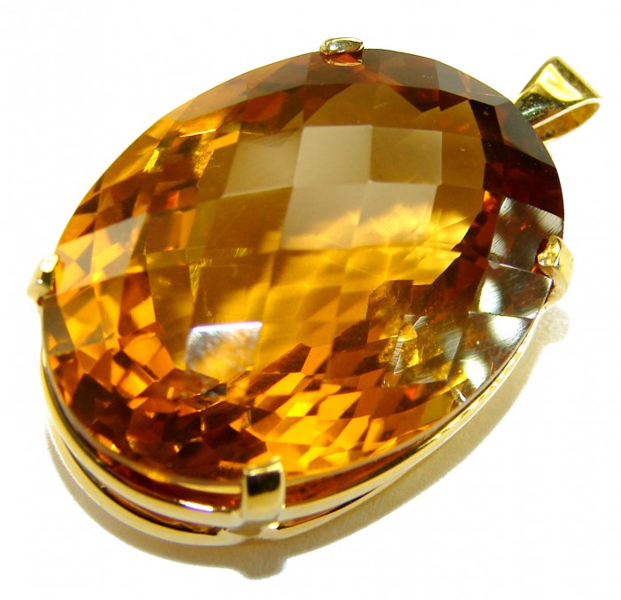Luxury genuine 39.7 CARAT oval cut Champagne Topaz .925 Sterling Silver dipped in 22K Gold handmade Pendant - Close-up of luxury oval-cut Champagne Topaz pendant in gold setting.