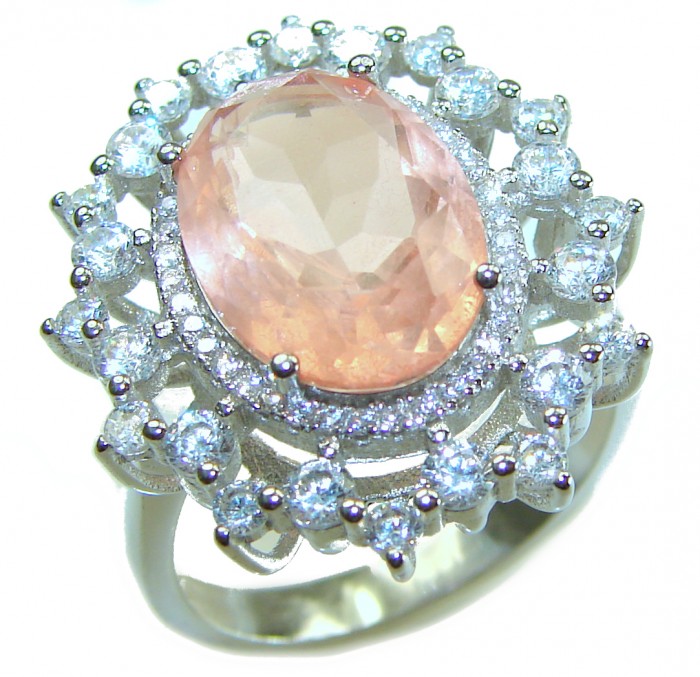 Authentic oval cut 9.2 carat Morganite 14K White Gold over .925 Sterling Silver ring s. 8 1/4 - Close-up of an oval cut Morganite ring with diamond halo detailing.