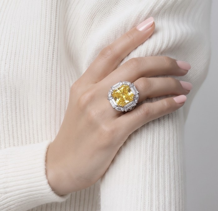 Art Deco - Luxurious asscher cut 15.7 carat Yellow Sapphire rhodium over .925 Sterling Silver handcrafted Ring s. 6 - Yellow sapphire ring worn on hand, showcasing the stone and setting.