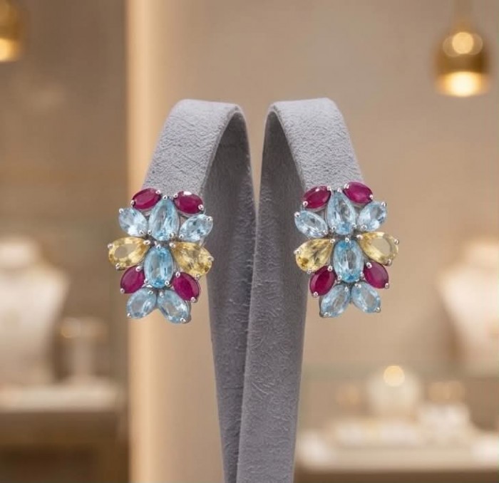 Dolce Vita 29.7 carat Swiss Blue Topaz rhodium over .925 Sterling Silver Handcrafted Statement earrings - Colorful gemstone earrings displayed on a stand, front view