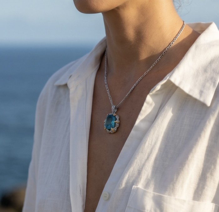 Rio Grande do Norte - Brazilian's Briliance - oval cut 19.7 carat Paraiba Tourmaline 2 tones .925 Sterling Silver handcrafted necklace - Necklace with blue oval gemstone pendant worn on a woman's neck