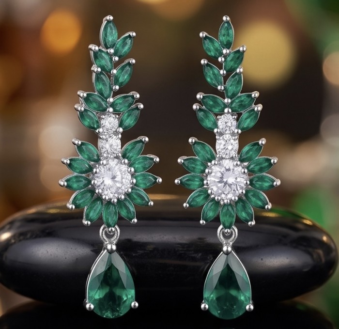 Giovanna - Authentic 7.9 carat COLOMBIAN EMERALD .925 Sterling Silver handcrafted earrings - Close-up of emerald and diamond earrings on black surface.