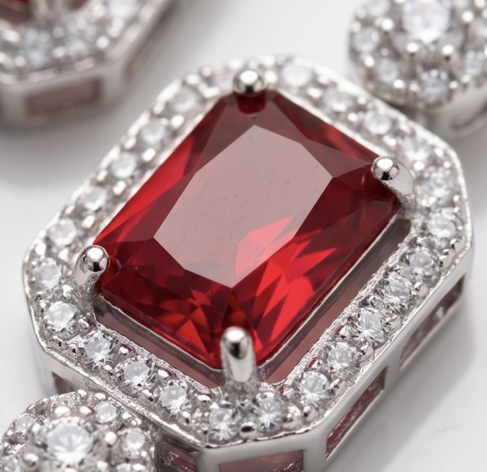 Exquisite 9.4 ctw Mozambique Ruby .925 Sterling Silver handcrafted Statement earrings - Close-up of Mozambique ruby in sterling silver with surrounding stones