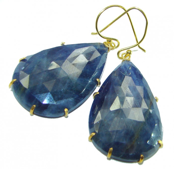 Giovanna - Authentic oval cut 27.9 carat faceted SAPPHIRE .925 Sterling Silver handcrafted earrings - Close-up of faceted sapphire earrings with gold hooks.