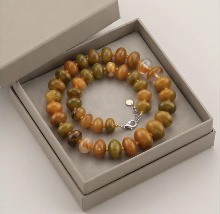 Top quality Rare Unusual Natural Mookiate .925 Sterling Silver Necklace - Mookaite necklace in box, top view, showing clasp and bead detail.