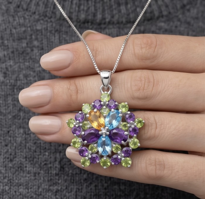 Colors of the Earth Precious 18.5 carat Multigem .925 Sterling Silver dipped in rhodium Pendant - Multigem silver pendant, close-up worn on hand.
