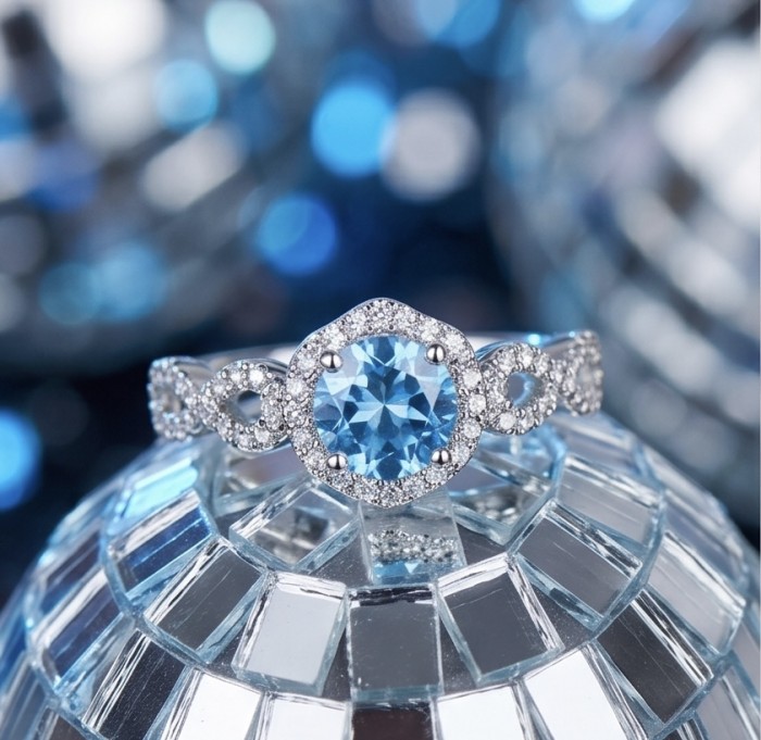 Atlntica 5.8 carat Swiss Blue Topaz .925 Sterling Silver dipped in rhodium handcrafted ring size 8 - Close-up of Atlntica Swiss Blue Topaz ring on reflective surface