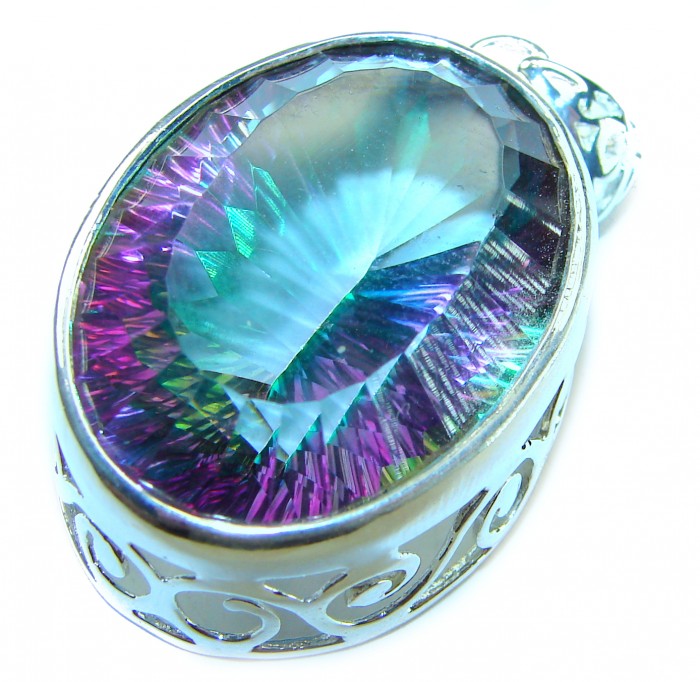 Blue Wonderland 49.7 carat oval cut Mystic Aurora Topaz .925 Sterling Silver handcrafted Pendant - Close-up of Blue Wonderland Mystic Aurora Topaz in ornate setting.