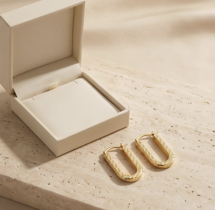 Black Label Collection - Dubai Style - Natural 22K Gold over .925 Sterling Silver handmade earrings - Gold hoop earrings displayed beside an open box, top view.