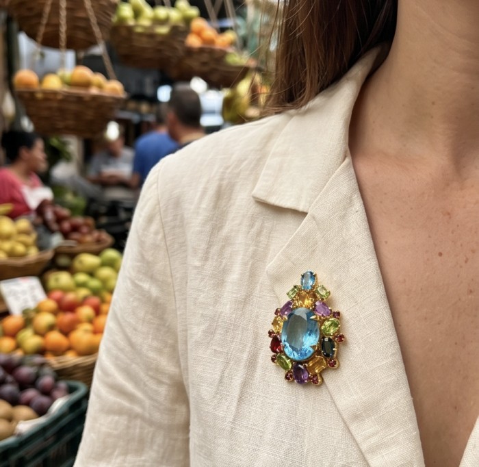 Majestic - Vintage style oval cut 15.8 carat Swiss Blue Topaz .925 Sterling Silver DIPPED IN 22 carat Gold handmade Pendant Brooch - Jewelry on cream suit in market, front view, Swiss Blue To 15.8 carats