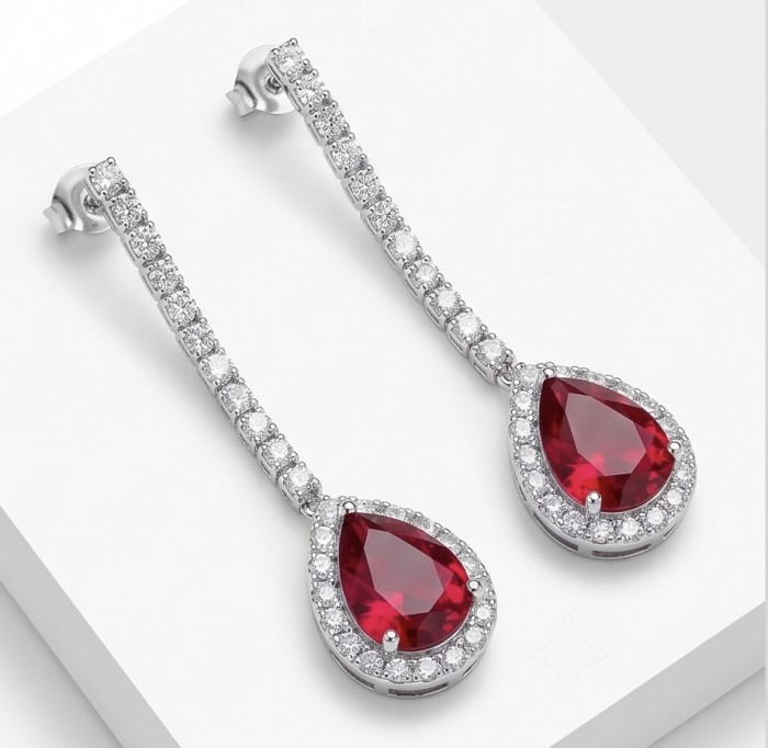 Giovanna - Magnificent Jewel 4.5 carat Ruby .925 Sterling Silver handcrafted incredible earrings - Elegant drop earrings with rubies and diamonds on white background.