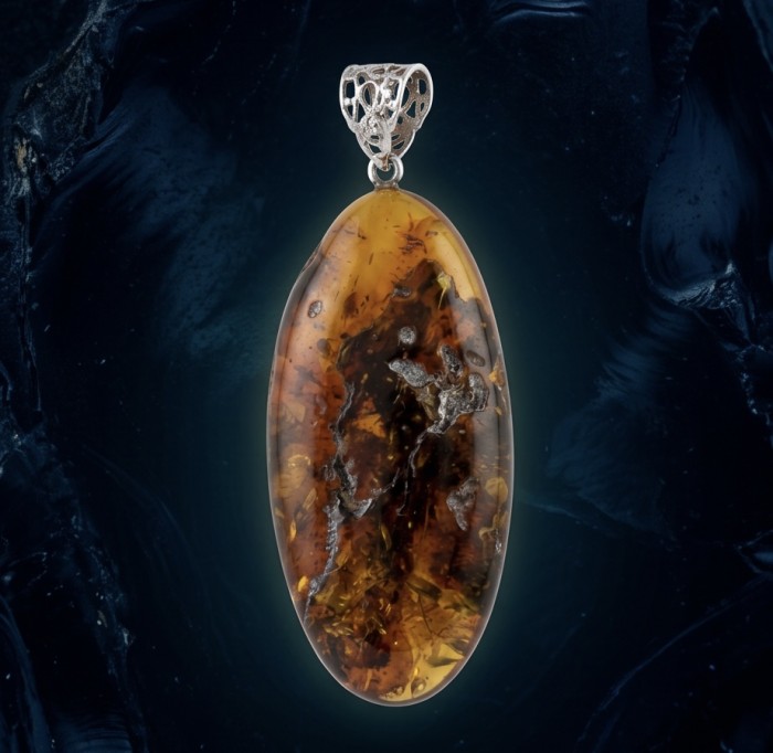 Prehistoric Authentic Golden Baltic Amber .925 Sterling Silver beautifully handcrafted Pendant - Close-up of golden Baltic amber pendant with intricate silver bail.