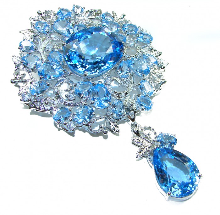 An exuberantly Large 75.5 grams Vintage style Swiss Blue Topaz .925 Sterling Silver DIPPED IN RHODIUM handmade LARGE Pendant - Brooch - Close-up of vintage-style Swiss Blue Topaz brooch with intricate design.