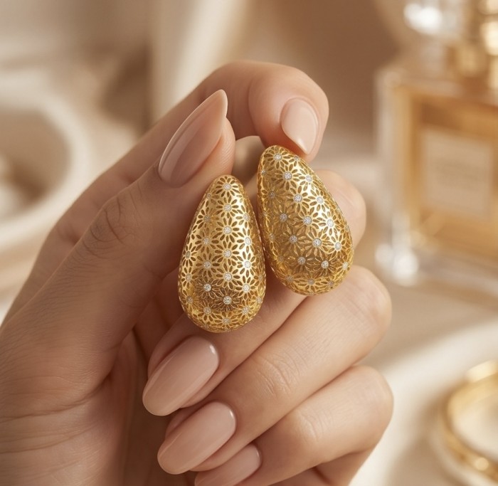 Dubai Style - Golden fancy Drops .925 Sterling Silver dipped in 22K Gold handmade Earrings - Close-up of gold teardrop earrings with intricate floral design.
