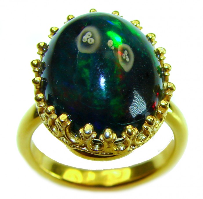 A COSMIC POWER Genuine 15.2 carat Black Opal 18K Gold over .925 Sterling Silver handmade Ring size 7 - Close-up of black opal ring set in 18K gold.