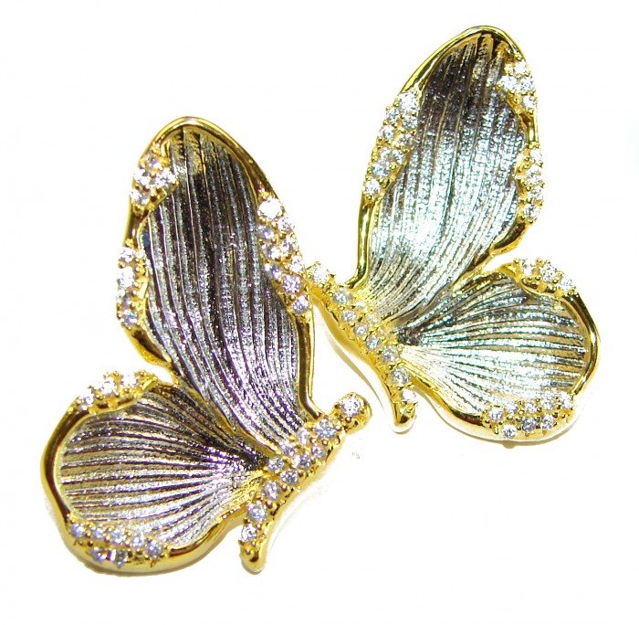 Golden Butterfly White Topaz highly polished 18K Gold over .925 Sterling Silver Italy made Earrings - Two gold butterfly earrings with white topaz, top view.