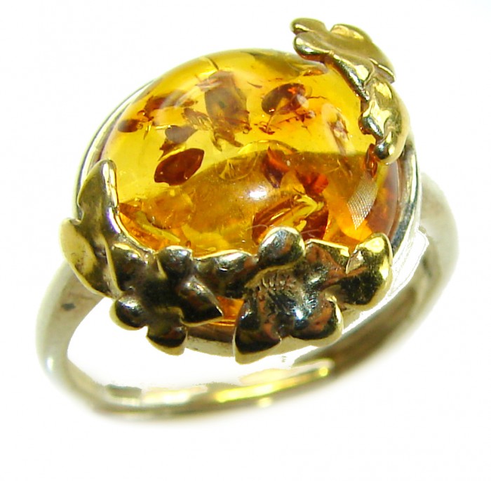 Authentic Baltic Amber .925 Sterling Silver handcrafted ring; s. 6 adjustable - Close-up of Baltic amber ring with floral silver setting.