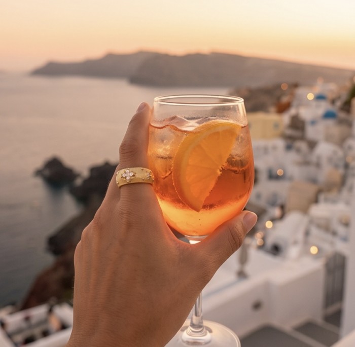Precious 1.2 carat Whiet Topaz 18K Gold over .925 Sterling Silver ring size 7 - 18K gold ring with white topaz, worn on hand, sunset view in background.