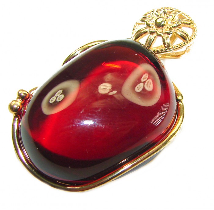 Prehistoric cognac Authentic Baltic Amber 14K Gold over.925 Sterling Silver beautifully handcrafted Pendant - Close-up of red Baltic amber set in gold with floral detailing