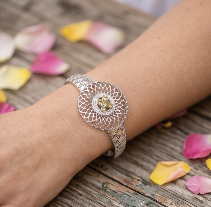 Casablanca - authentic 2.2 carat green Tourmaline .925 Sterling Silver Bracelet - Intricate bracelet with green Tourmaline, worn on wrist with petals nearby.