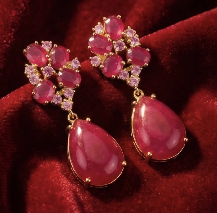 Giovanna - Magnificent Jewel - 24.2 carat Kashmir Ruby .925 Sterling Silver dipped in 22K Gold handcrafted incredible Statement earrings - Close-up of Giovanna earrings with Kashmir rubies on velvet background.