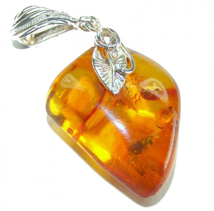 Fabulous Baltic Amber .925 Sterling Silver handmade Pendant - Close-up of Baltic Amber and sterling silver pendant with leaf details.