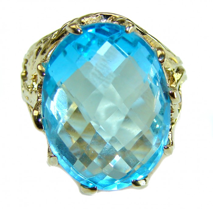Rare finding - Costa del Sol 33.8 carat Swiss Blue Topaz 18K Gold over .925 Sterling Silver Handcrafted Large Statement Ring size 7 - Close-up of a Swiss Blue Topaz ring with intricate gold setting.
