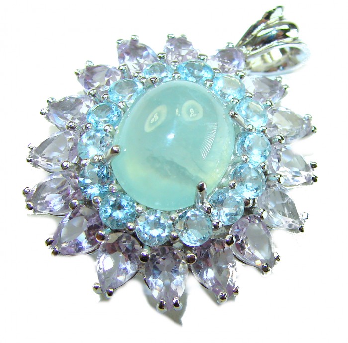 Royal quality genuine 19.8 carat Prehnite rhodium over .925 Sterling Silver handcrafted Pendant - Close-up of a Prehnite pendant with surrounding gemstones and rhodium setting.