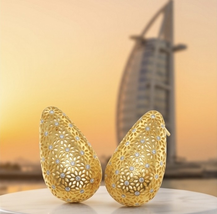 Dubai Style - Golden fancy Drops .925 Sterling Silver dipped in 22K Gold handmade Earrings - Golden fancy drop earrings in lace design, side view, with Dubai skyline.