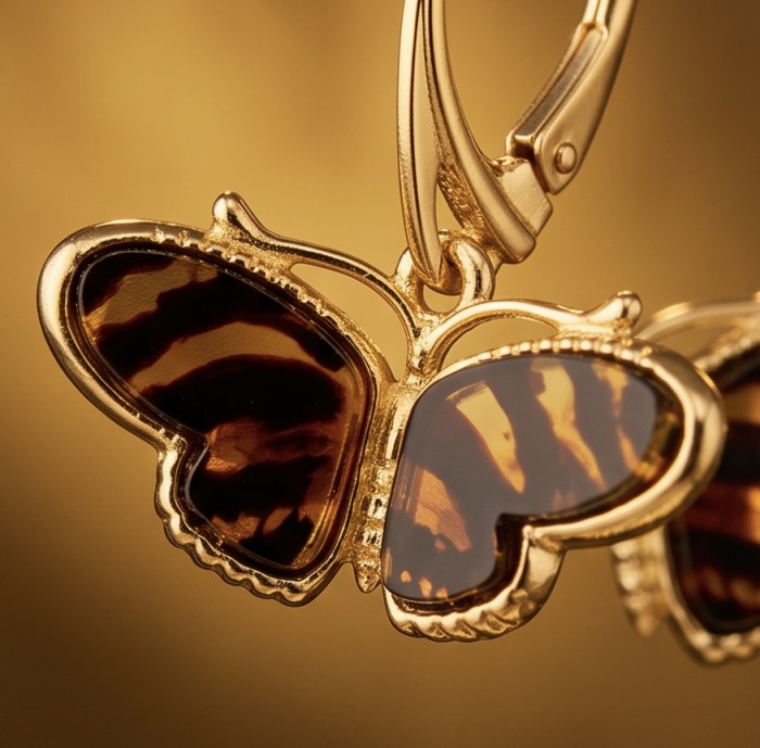 Butterflies carved Baltic Polish Amber 14K Gold over .925 Sterling Silver earrings - Close-up of butterfly-shaped amber earrings in 14K gold.