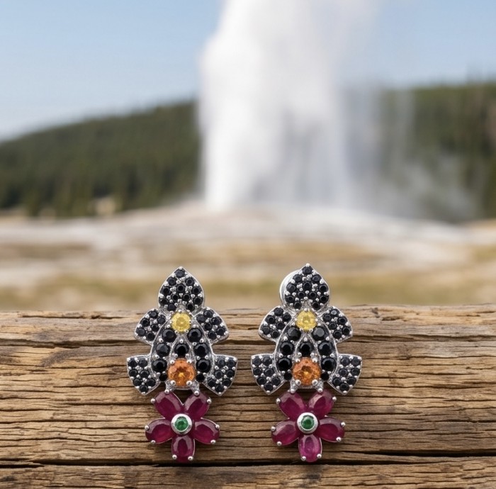 Rosalie 12.4 ctw Ruby .925 Sterling Silver dipped in rhodium handcrafted Statement earrings - Rosalie ruby earrings front view with geyser background