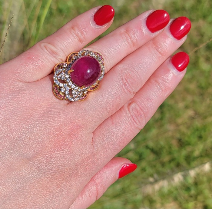 Empress 28.6 ctw Mozambique Star Ruby .925 Sterling Silver dipped in 22K Gold handcrafted Statement Ring size 7 - Ruby ring worn on hand, with sparkling accent stones.