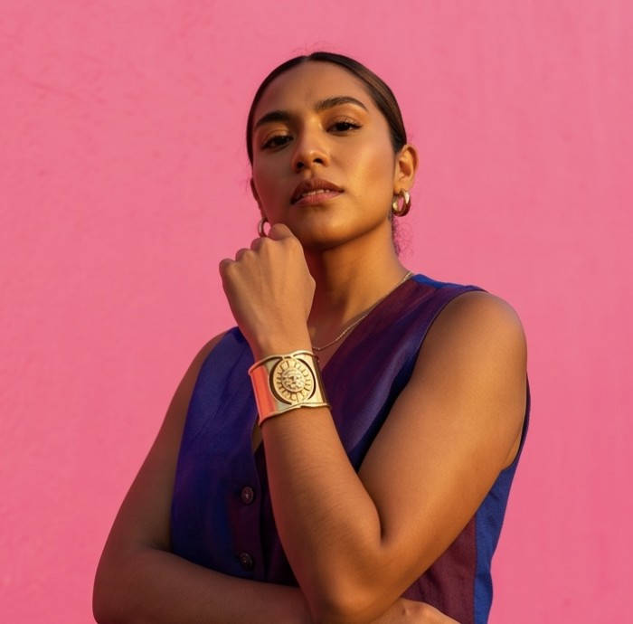 Renewal - Byzantine design 14K Gold over .925 Sterling Silver handcrafted Bracelet / Cuff - Worn on wrist, woman posing against pink wall, Byzantine gold bracelet