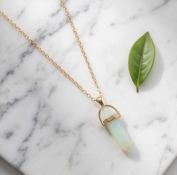 Incredible Design Opalite .925 Sterling Silver handmade Necklace - Opalite pendant necklace on marble background with a green leaf.