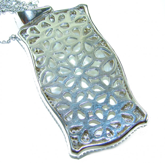Precious Blister Pearl 2.4 carat Ruby .925 Sterling Silver .925 Sterling Silver Necklace; 24 inches long - Back view of intricate filigree on sterling silver pendant necklace.