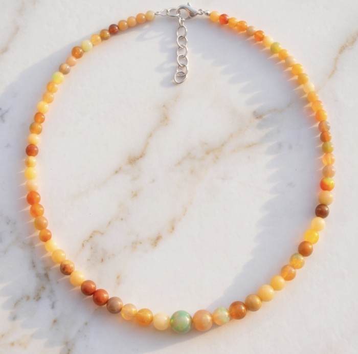Real Masterpiece Natural Ethiopian Opal .925 Sterling Silver Necklace - Ethiopian Opal necklace with sterling silver clasp on marble background.