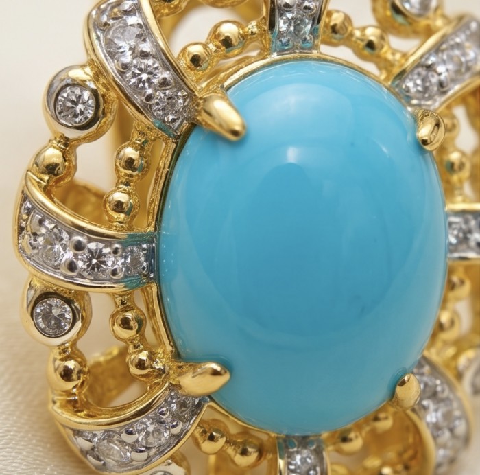 Sofia - authentic Sleeping Beauty Turquoise 22K Gold over .925 Sterling Silver handcrafted Earrings - Close-up of a turquoise and gold ring with diamond accents.