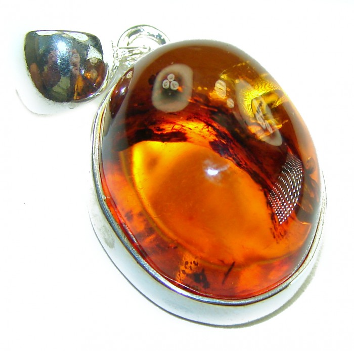 Prehistoric Authentic Baltic Amber .925 Sterling Silver beautifully handcrafted Pendant - Close-up of Baltic amber pendant set in .925 sterling silver.