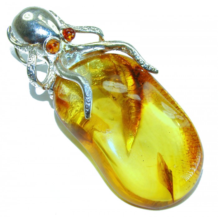 Enchanted Ocean - Large Octopus genuine Baltic Amber .925 Sterling Silver handmade Pendant - Octopus Baltic amber pendant, top view showing stone and intricate silver design.