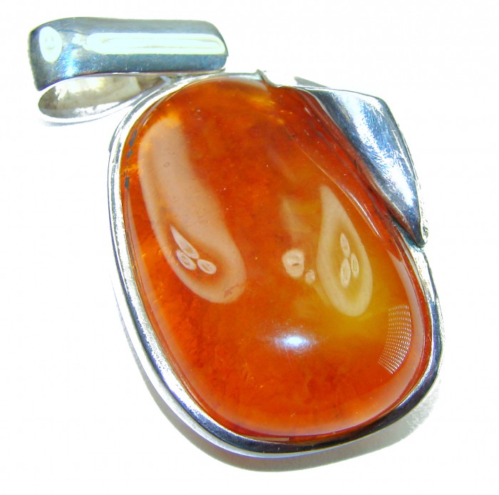 Prehistoric Authentic Baltic Amber .925 Sterling Silver beautifully handcrafted Pendant - Close-up of Baltic amber and sterling silver pendant.