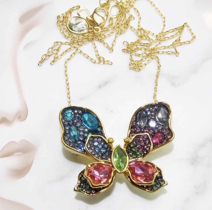 Precious Colorful Butterfly14.2 carat natural Topaz 14K Gold over .925 Sterling Silver Necklace - Brooch - Close-up of colorful gemstone butterfly necklace on a marble surface.