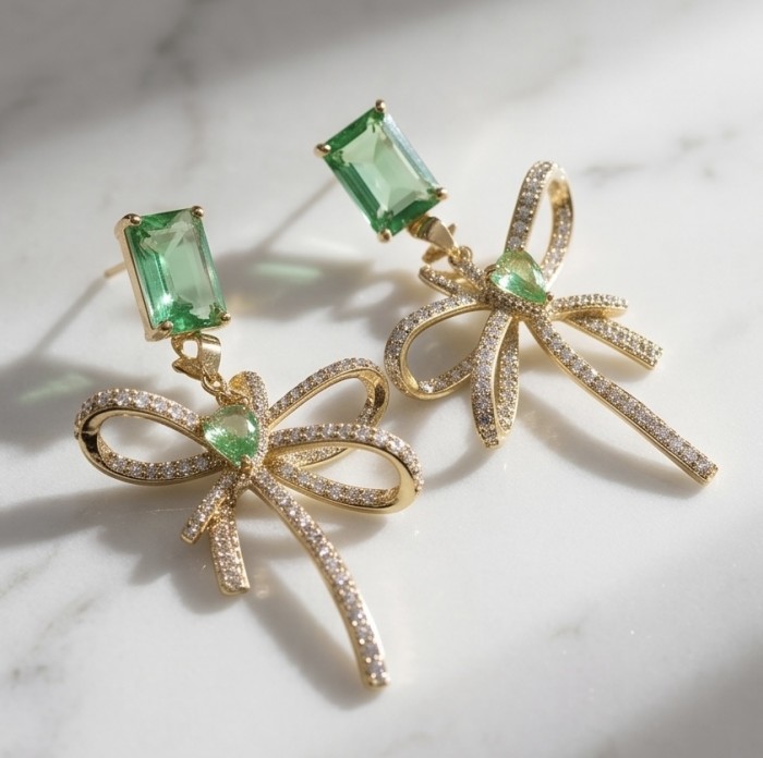 Luzurious 7.9 carat authentic Himalayan Peridot .925 Sterling Silver dipped in 14K Gold Handcrafted Statement Earrings - Close-up of Himalayan Peridot earrings on marble surface.