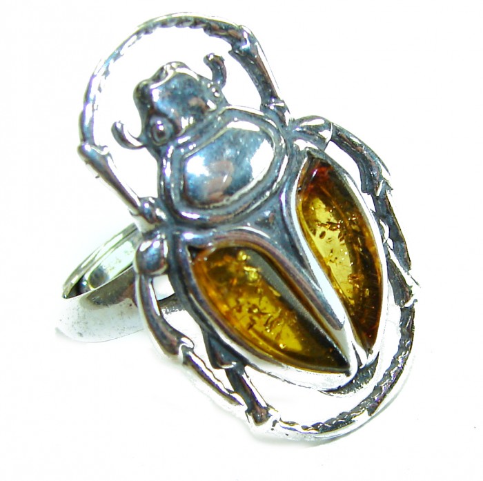 Unique creation - The Egyptian Scarab Beetle natural Baltic Amber .925 Sterling Silver handcrafted .925 Sterling Silver handmade ring s. 7 adjustable - Beetle-shaped sterling silver ring with amber details, top view.