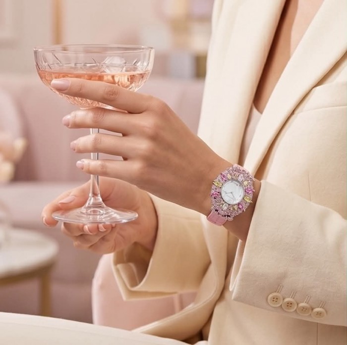 Precious 18.5 carat Authentic Pink Sapphire Genuine Leather strap .925 Sterling Silver handmade Watch - Worn on wrist, pink sapphire watch, holding a champagne glass.