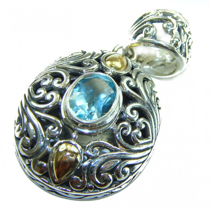 Costa del Sol 2.8 carat Swiss Blue Topaz 2 tones .925 Sterling Silver Handcrafted Pendant - Ornate pendant with blue topaz close-up against white background