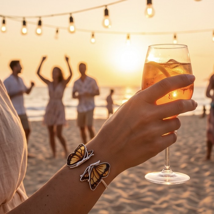 Golden Butterfly Genuine carved Baltic Amber .925 Sterling Silver dipped in rhodium handamde Bracelet - Worn on hand with beach party background, sunset warm glow.
