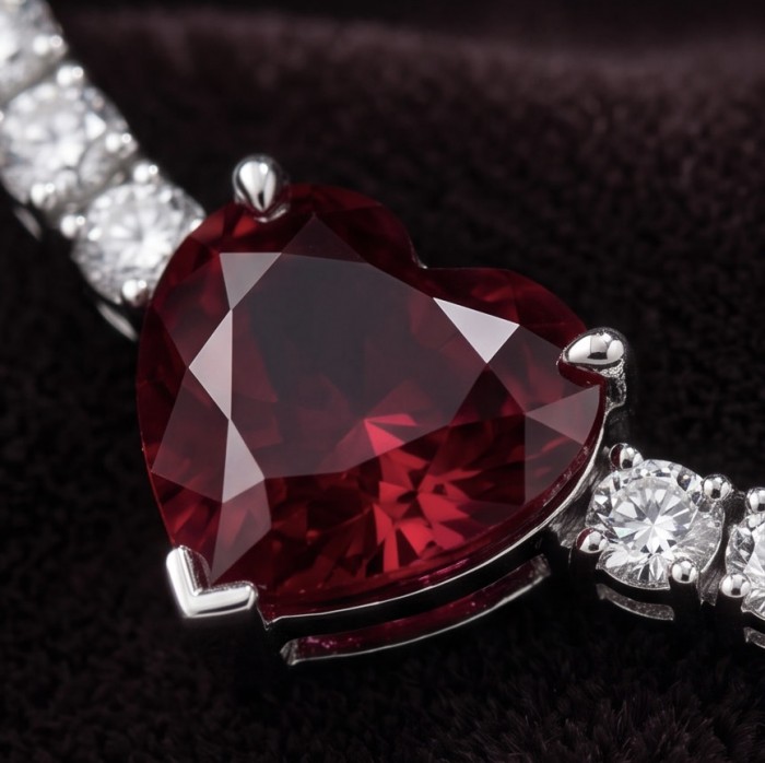 Red Heart - natural 8.5 carat Ruby .925 Sterling Silver handmade Statement necklace - Close-up of heart-shaped ruby in sterling silver setting with diamonds.