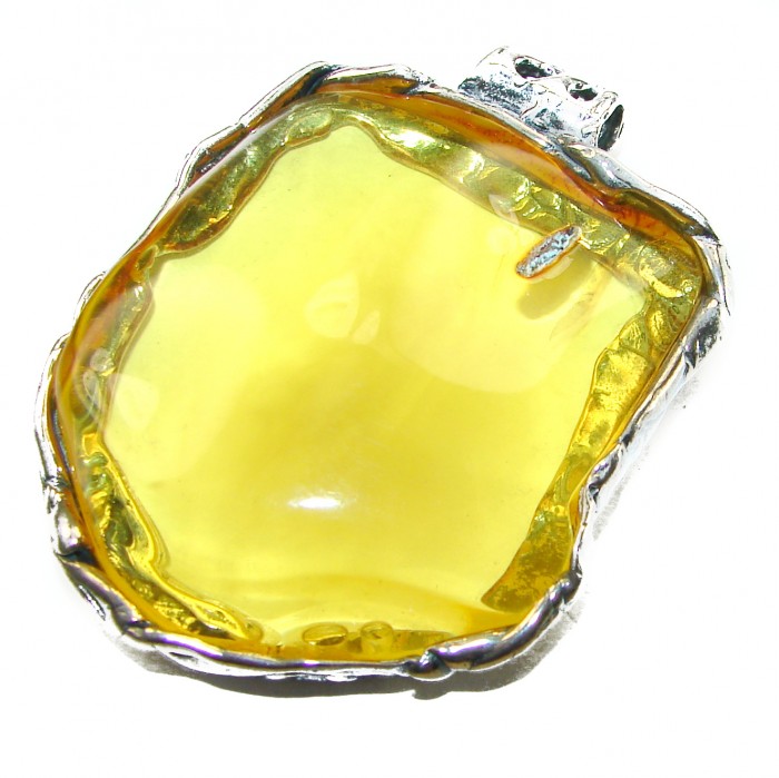 Prehistoric Authentic Baltic Amber .925 Sterling Silver beautifully handcrafted Large Pendant - Close-up of Baltic amber pendant with silver setting.